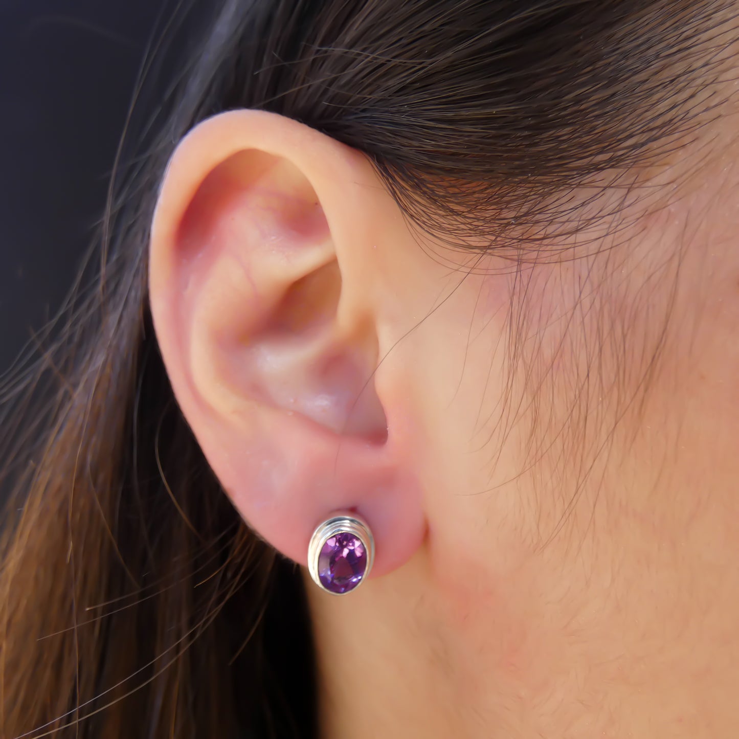 High polish plain setting sterling silver oval post earrings with amethyst.