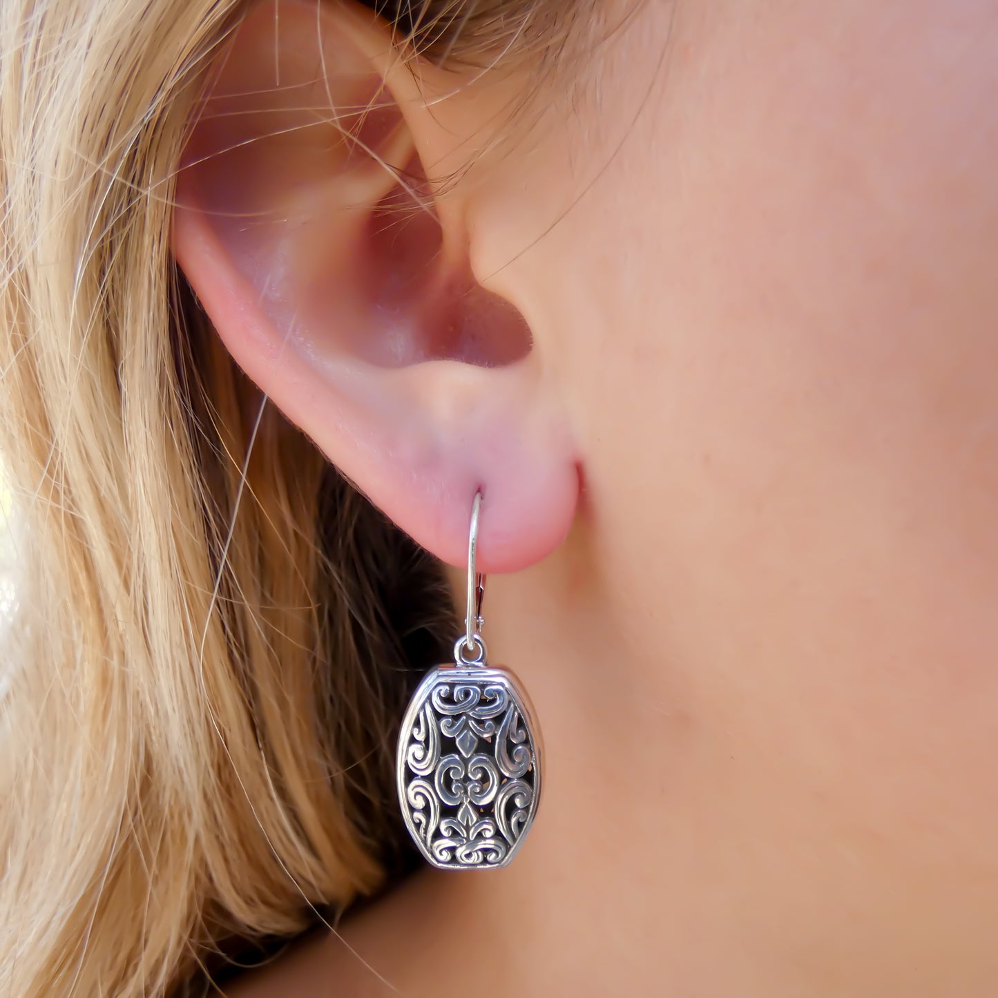 Sterling silver floral earrings.