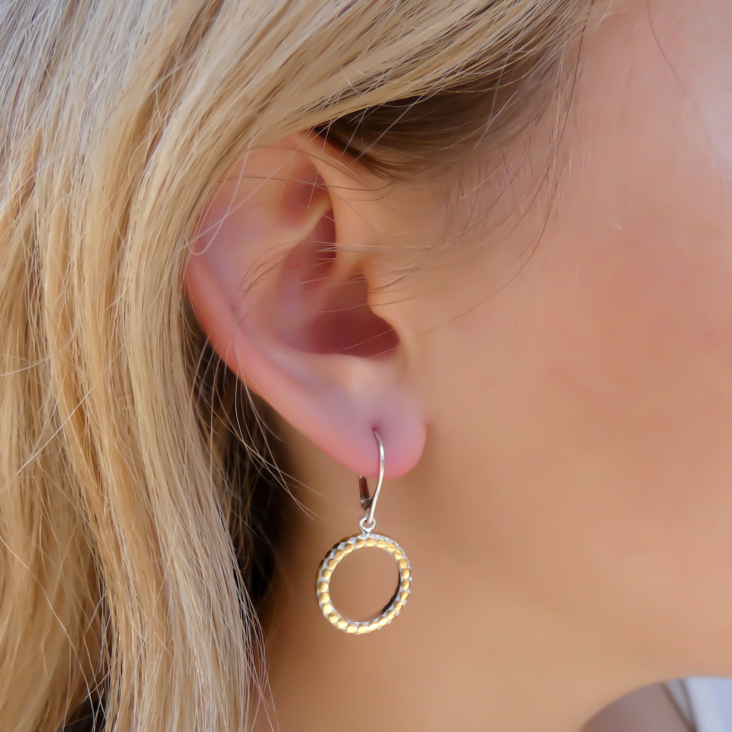 Sterling silver and gold round ring dangle earrings.