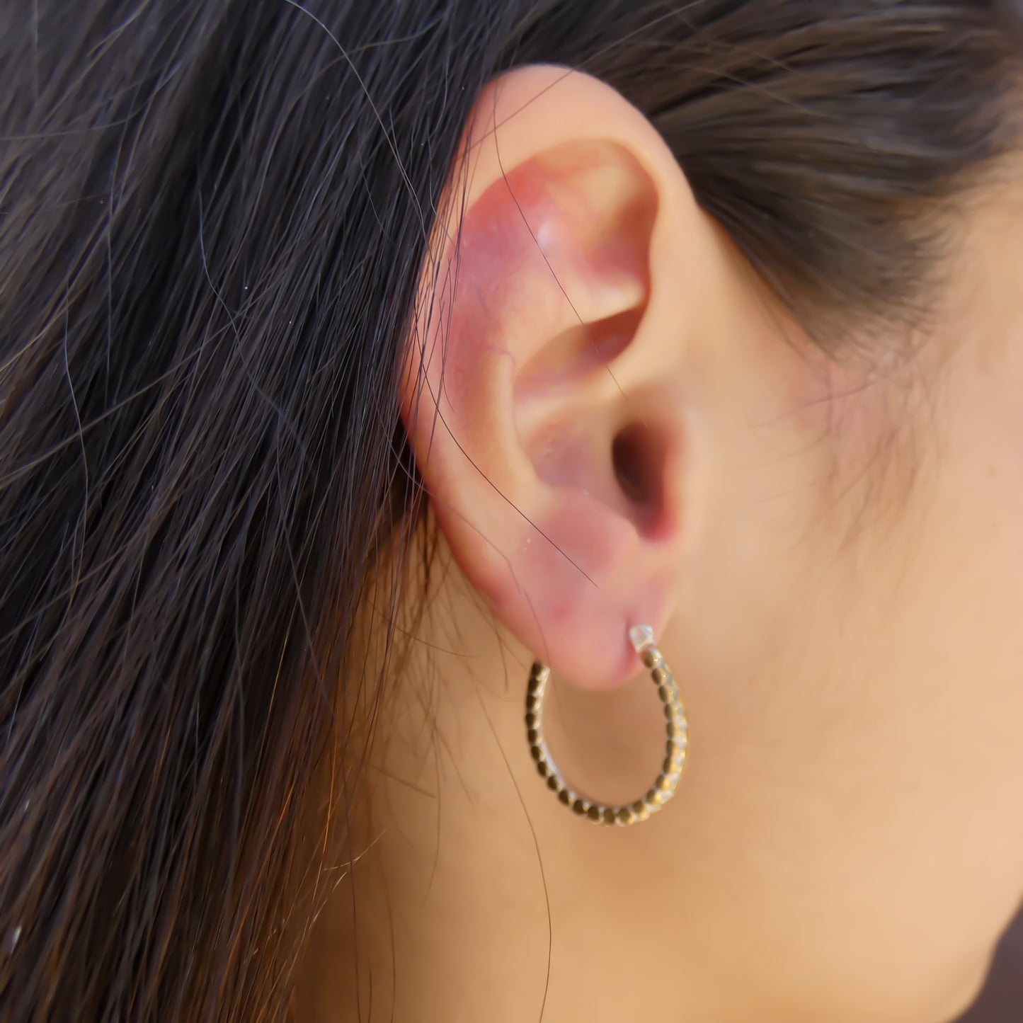 Sterling silver and gold horseshoe earrings.