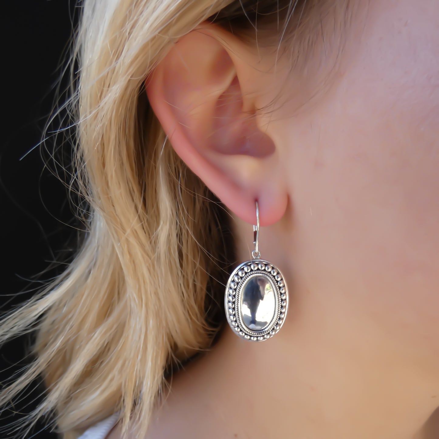Sterling silver mirror dome earrings.