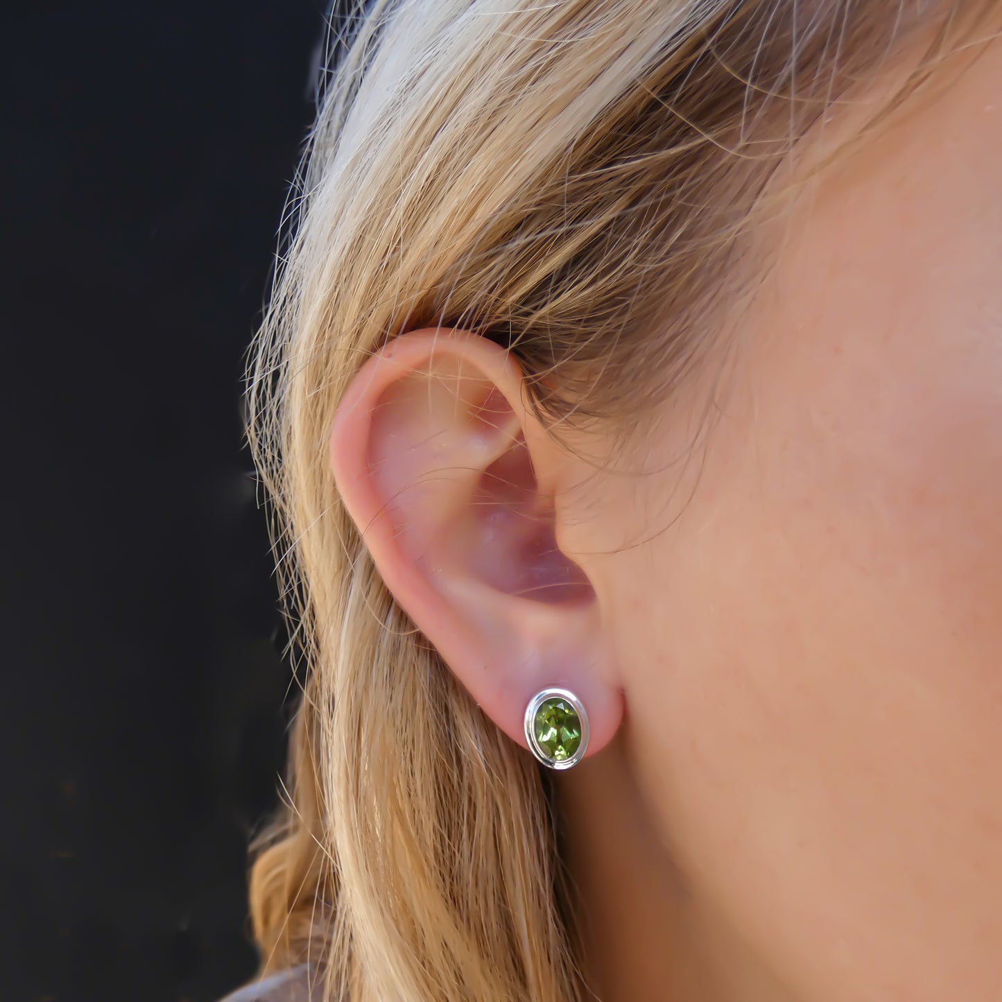 High polish plain setting sterling silver oval post earrings with peridot.