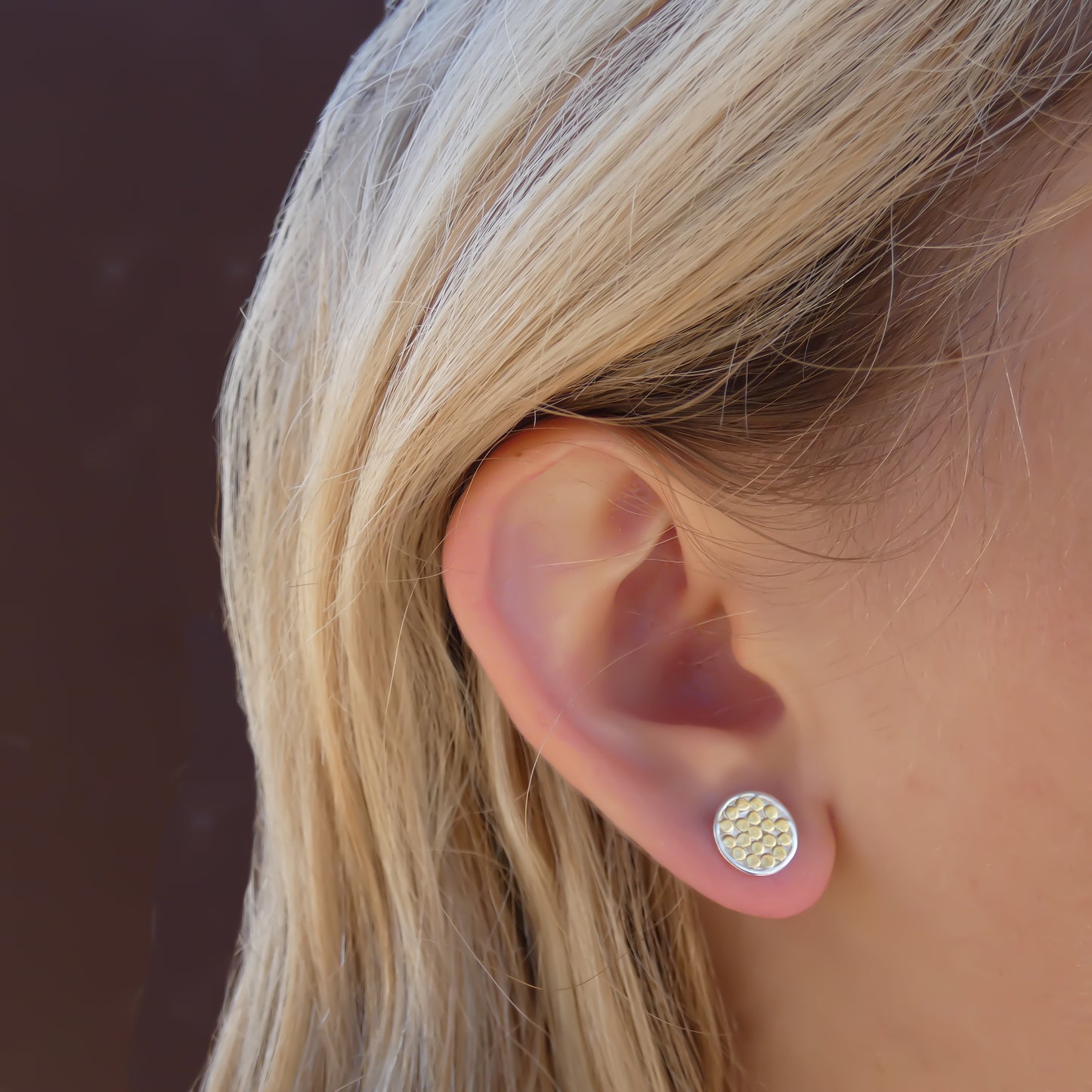 Sterling silver and gold post disc earrings.