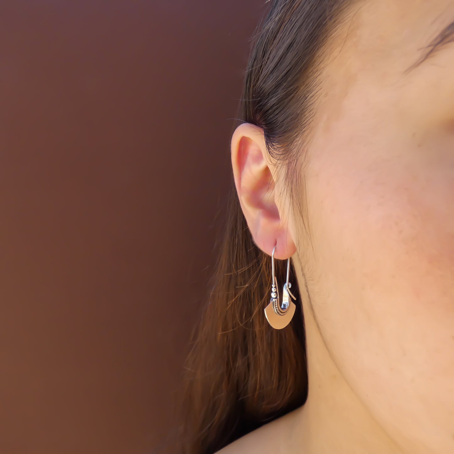 Sterling silver fan earrings.