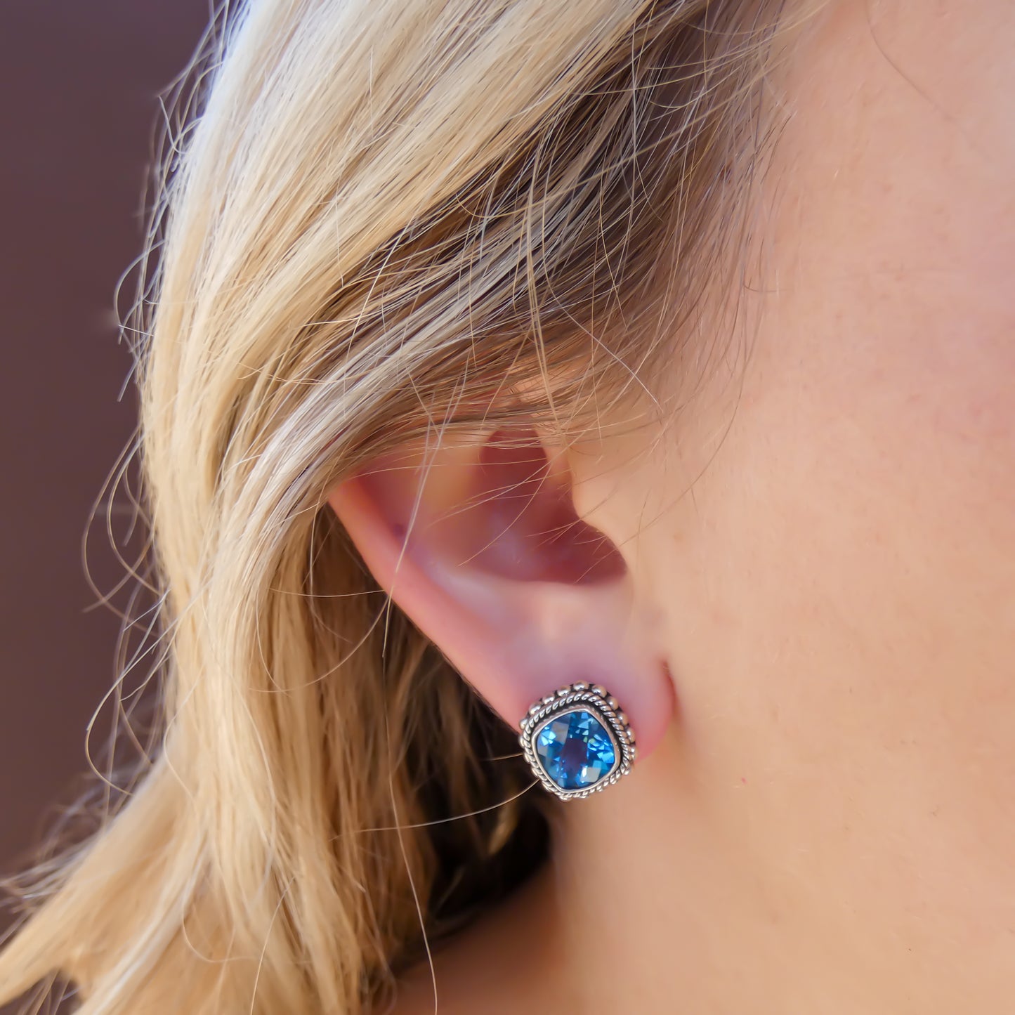 Sterling silver earrings with blue topaz.