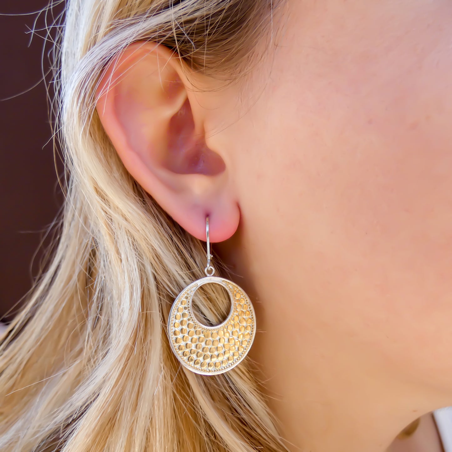 Sterling silver and gold dotted disc earrings.