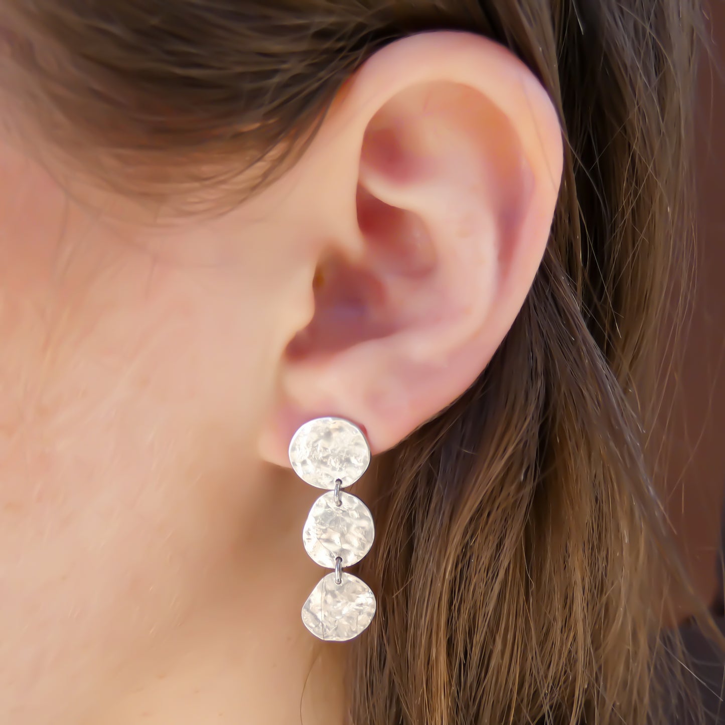 Sterling silver hammered dangle earrings.