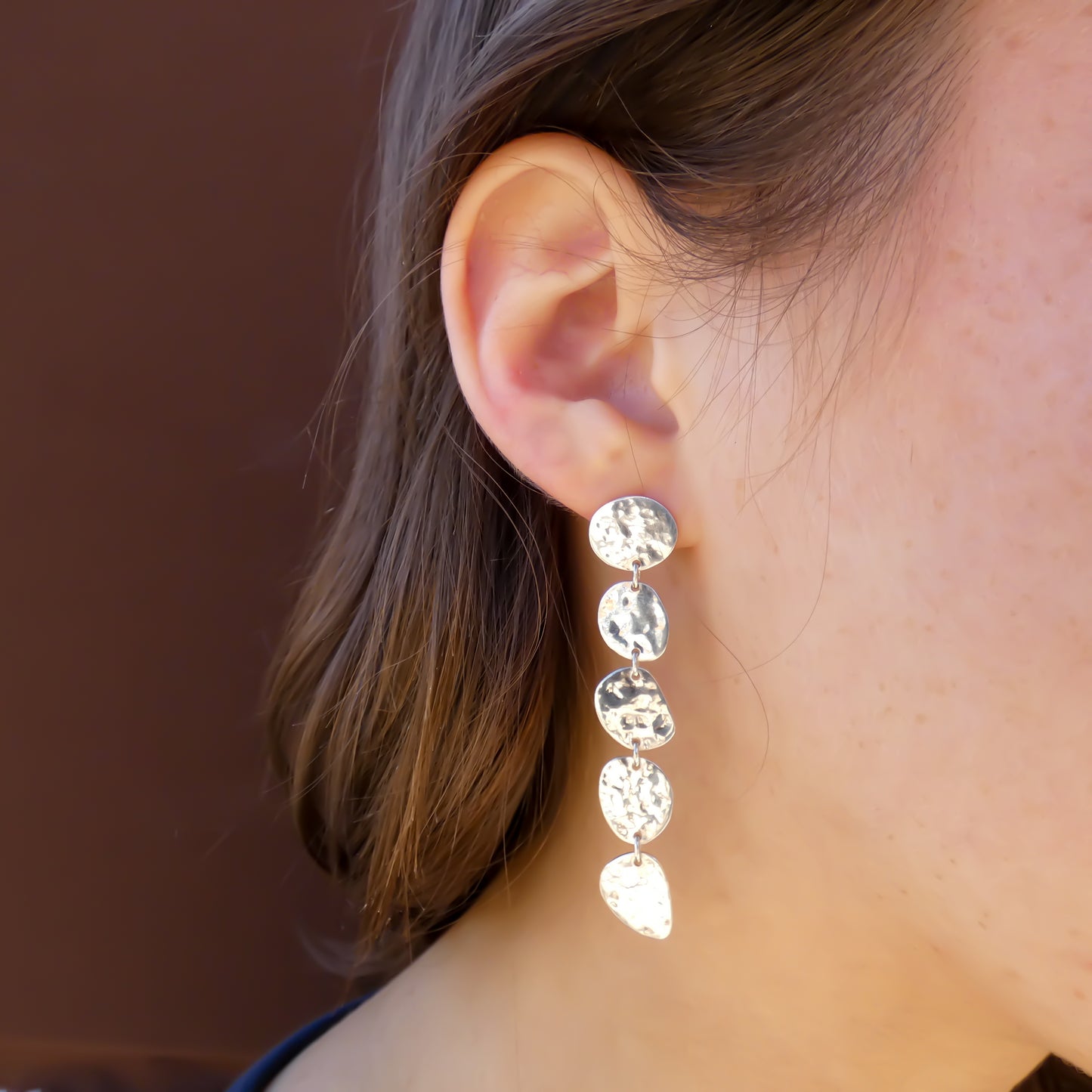 Sterling silver earrings with five hammered dangles.