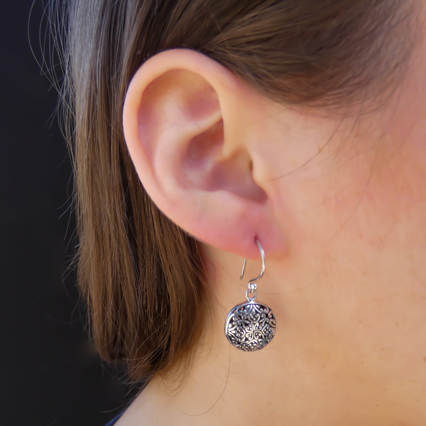 Sterling silver round dangle floral wire earrings.