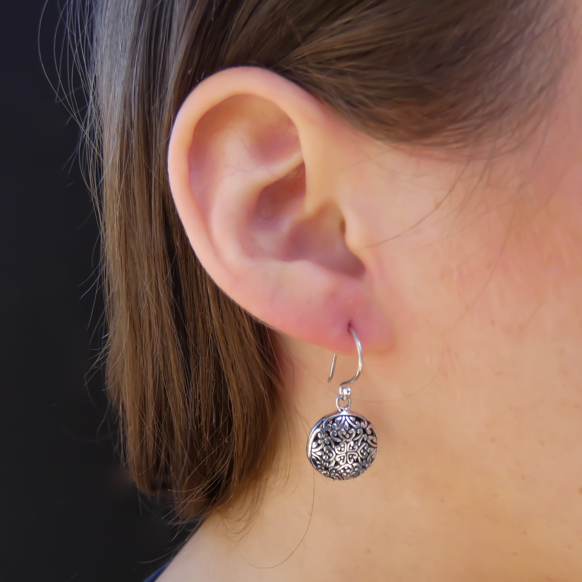 Sterling silver round dangle floral wire earrings.