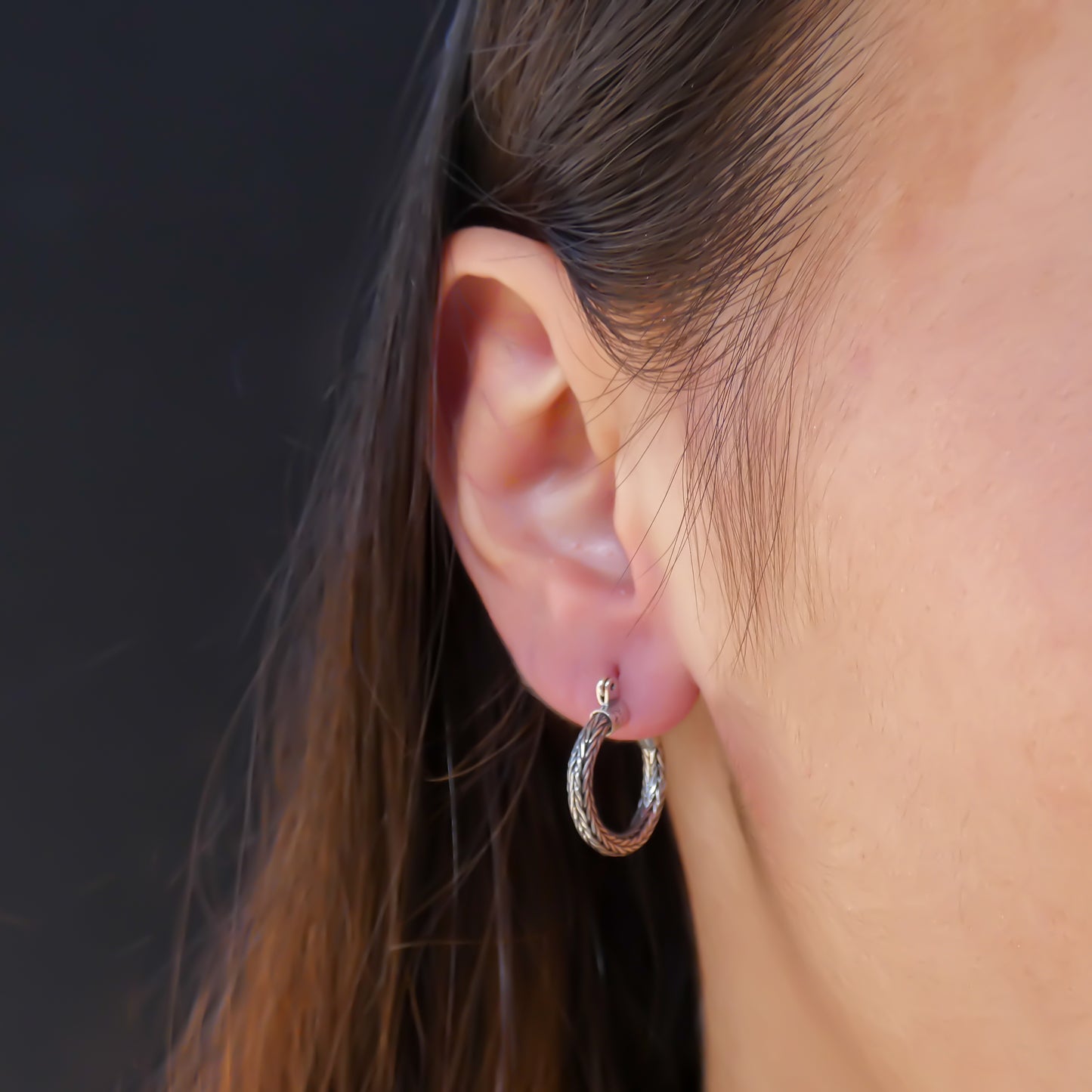 Sterling silver hoop earrings.