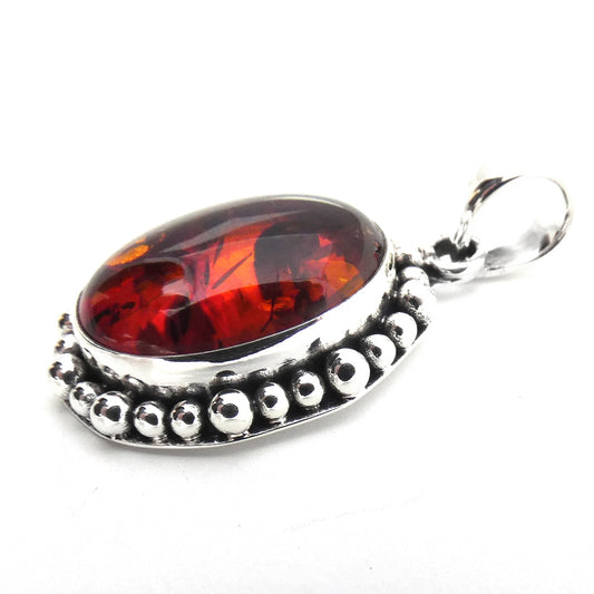 P004AB LIMITED .925 Sterling Silver Oval Amber Beaded Pendant.