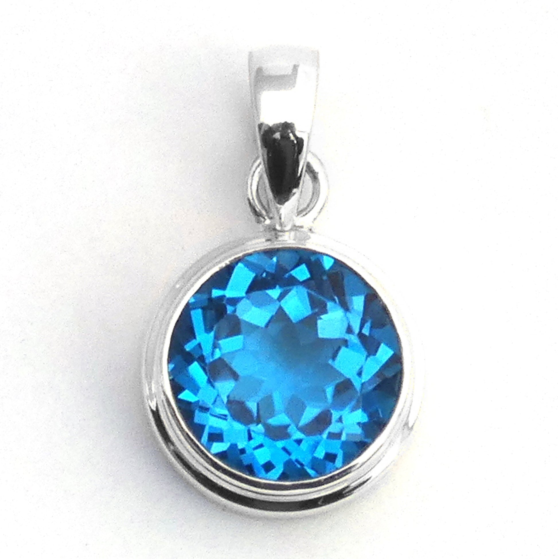 Sterling silver and Swiss blue topaz round pendant.