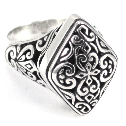 Sterling silver ring with ornate design.