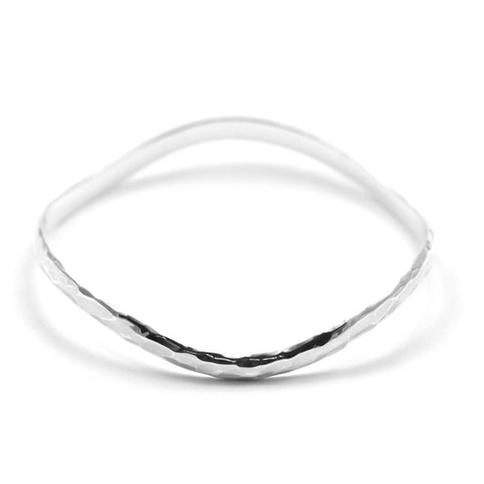 Wavy hammered silver bangle bracelet.