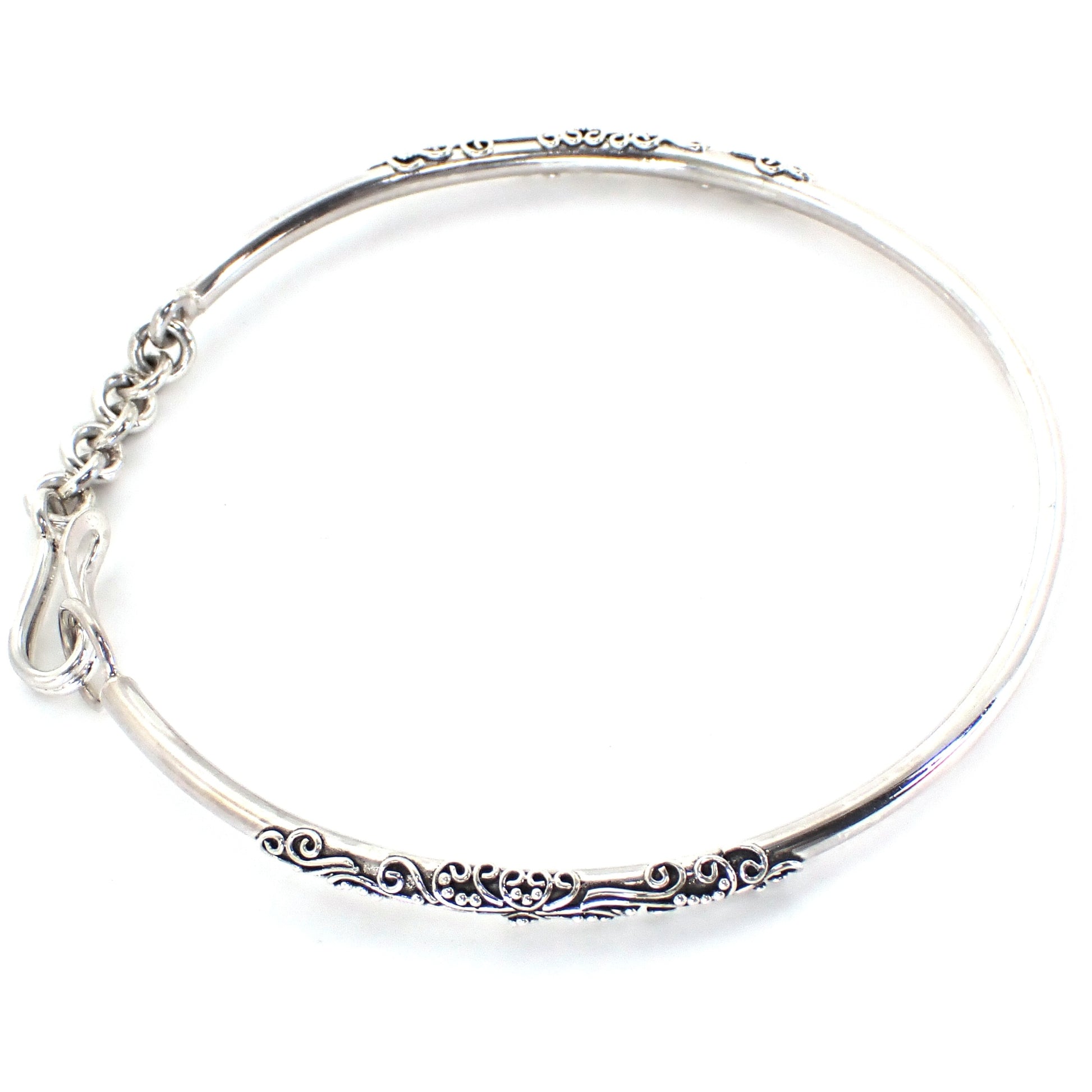 Silver bangle bracelet with a hook clasp.