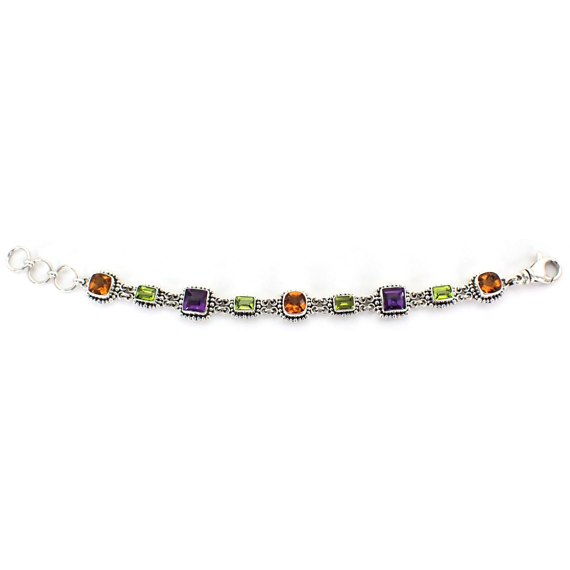 Multi-gemstone link bracelet with citrine, purple amethyst, and green peridot gemstones.