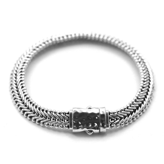 Flat herringbone silver chain bracelet with hammered barrel clasp.