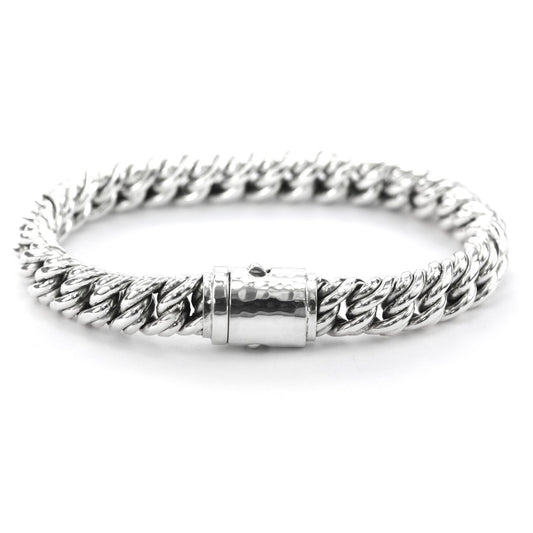 Heavy silver chain bracelet eight inches long with barrel clasp.