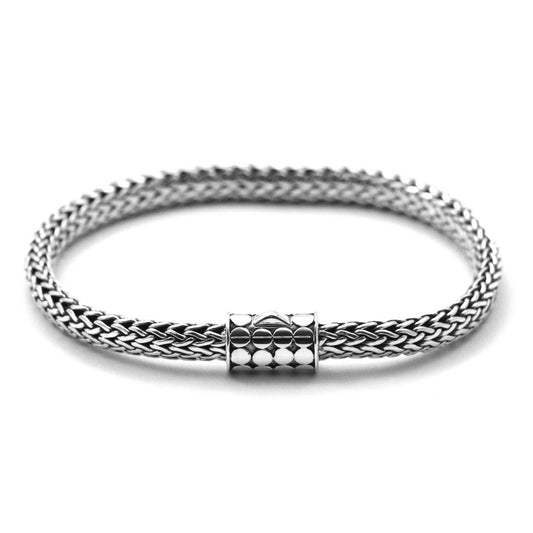 Silver snake chain bracelet with a single button barrel clasp.