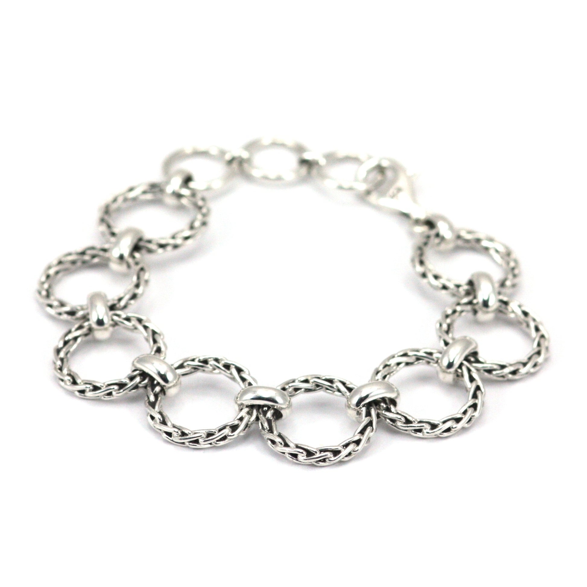 Silver bracelet made of rigid silver wheat ring links.