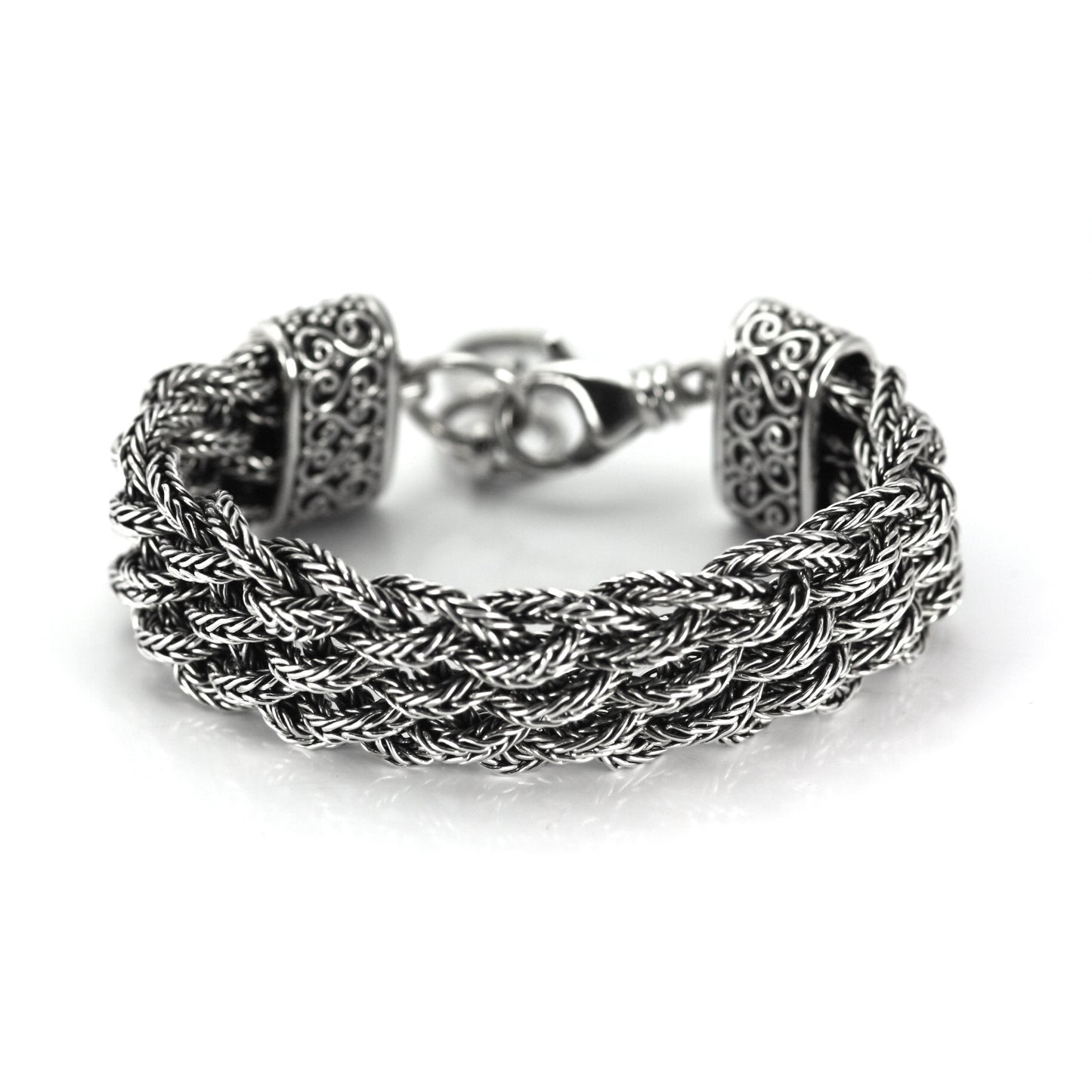 Wide braided silver wire bracelet.