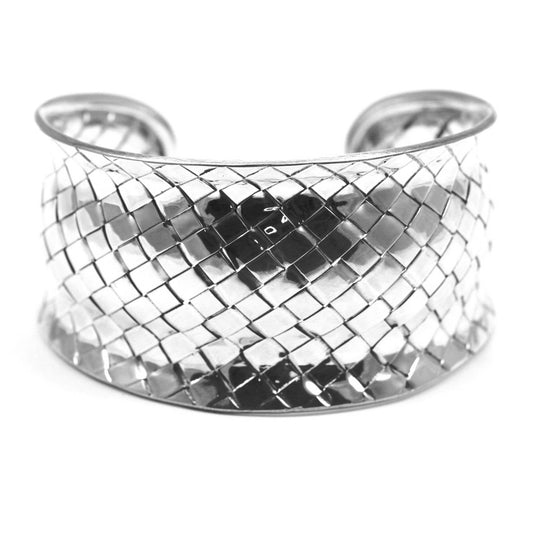 Woven silver cuff bracelet with multiple curves.