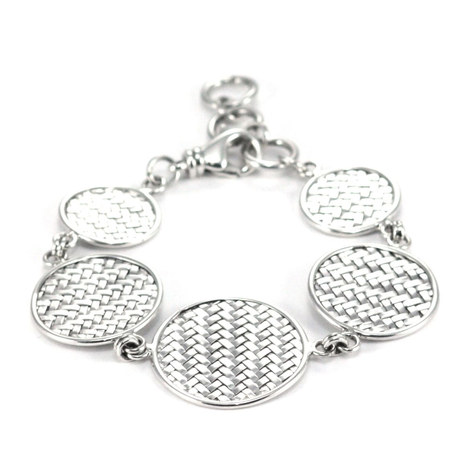 Silver bracelet made of five round woven discs of varying sizes.
