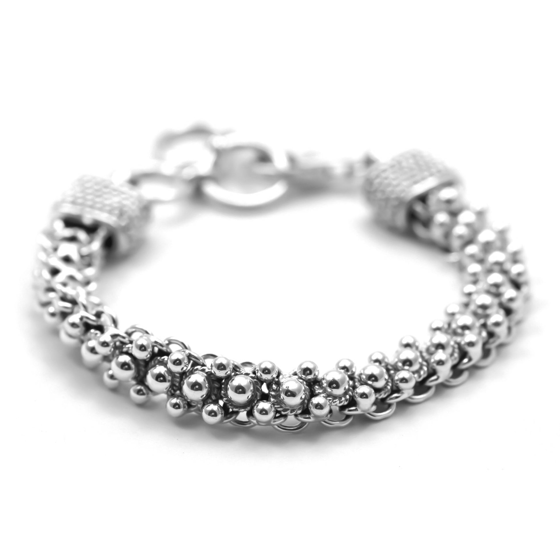 Flexible soft silver bracelet with polished bead design.
