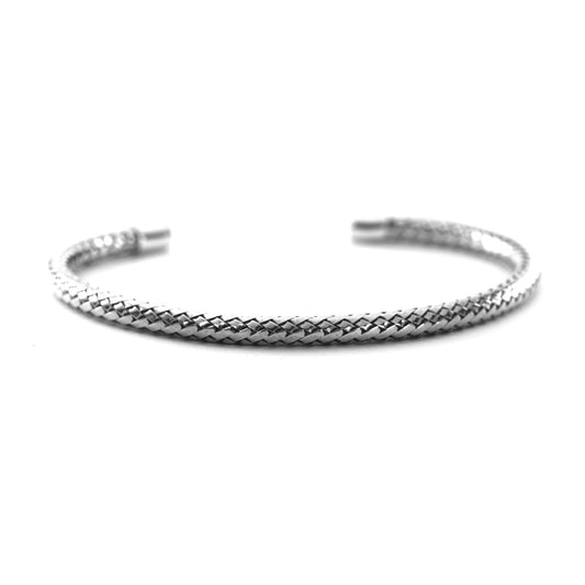 Woven tubular silver cuff bracelet with plain end caps.