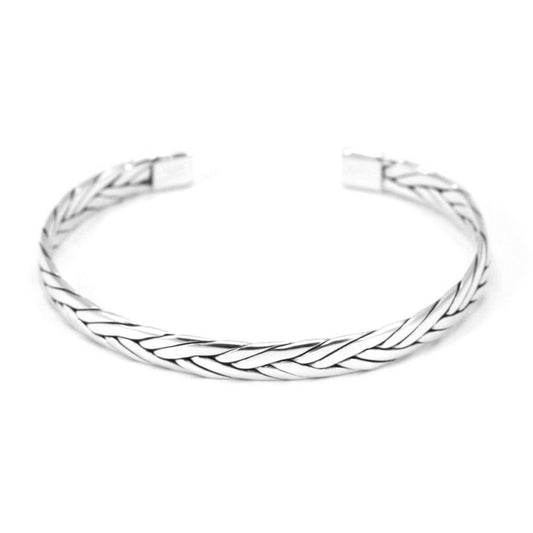 Silver cuff bracelet made of flat braided sterling strips.