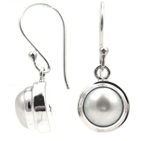 Sterling silver and pearl plain setting earrings.