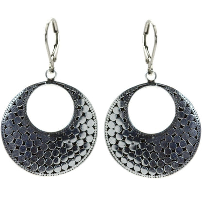 Sterling silver dotted disc earrings.