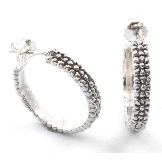 Sterling silver textured hoop earrings.