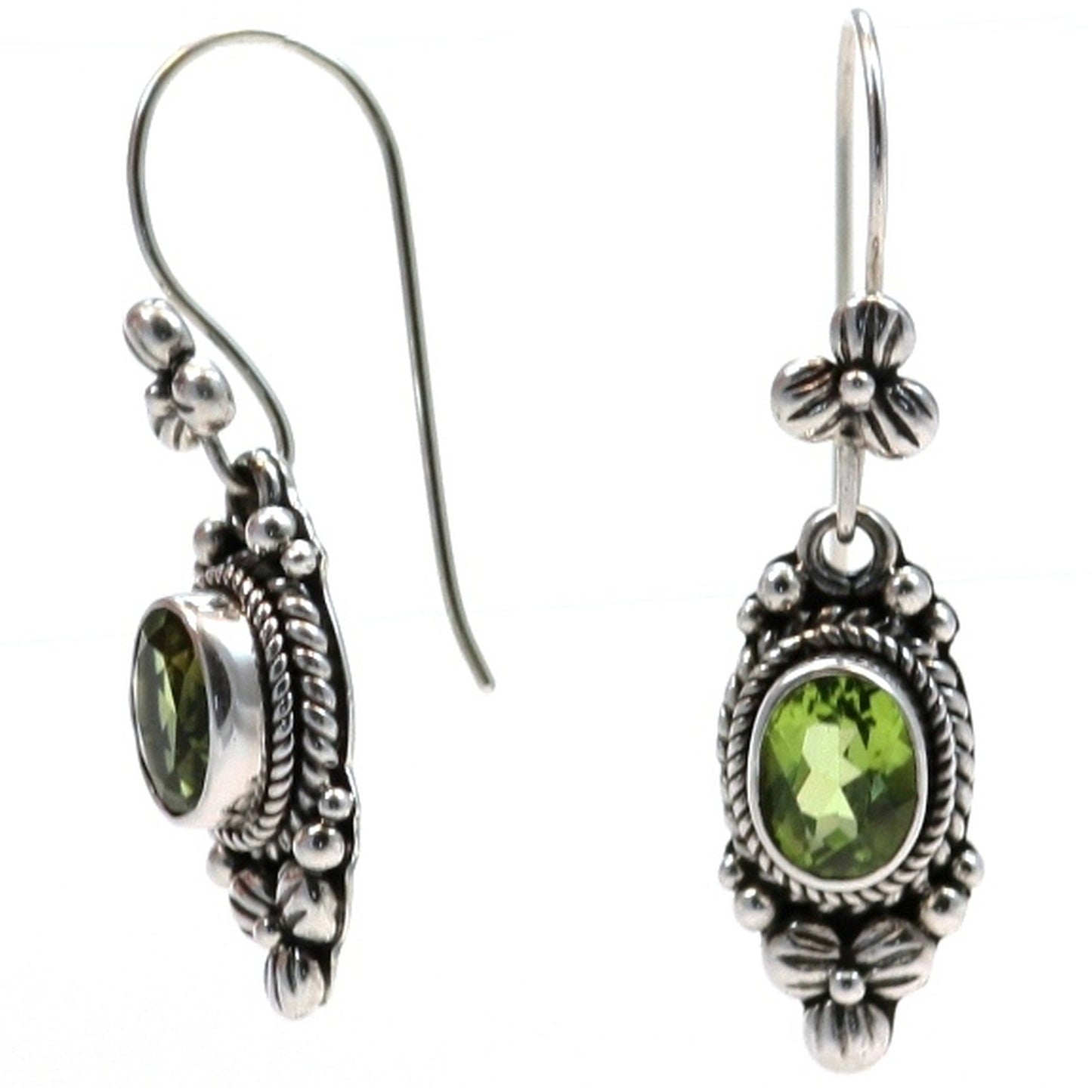 Silver wire drop earrings with floral design and peridot gemstones.