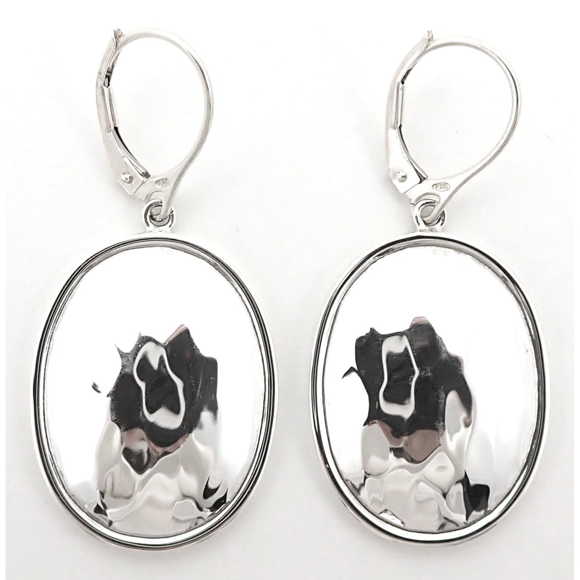 Silver hammered oval earrings.