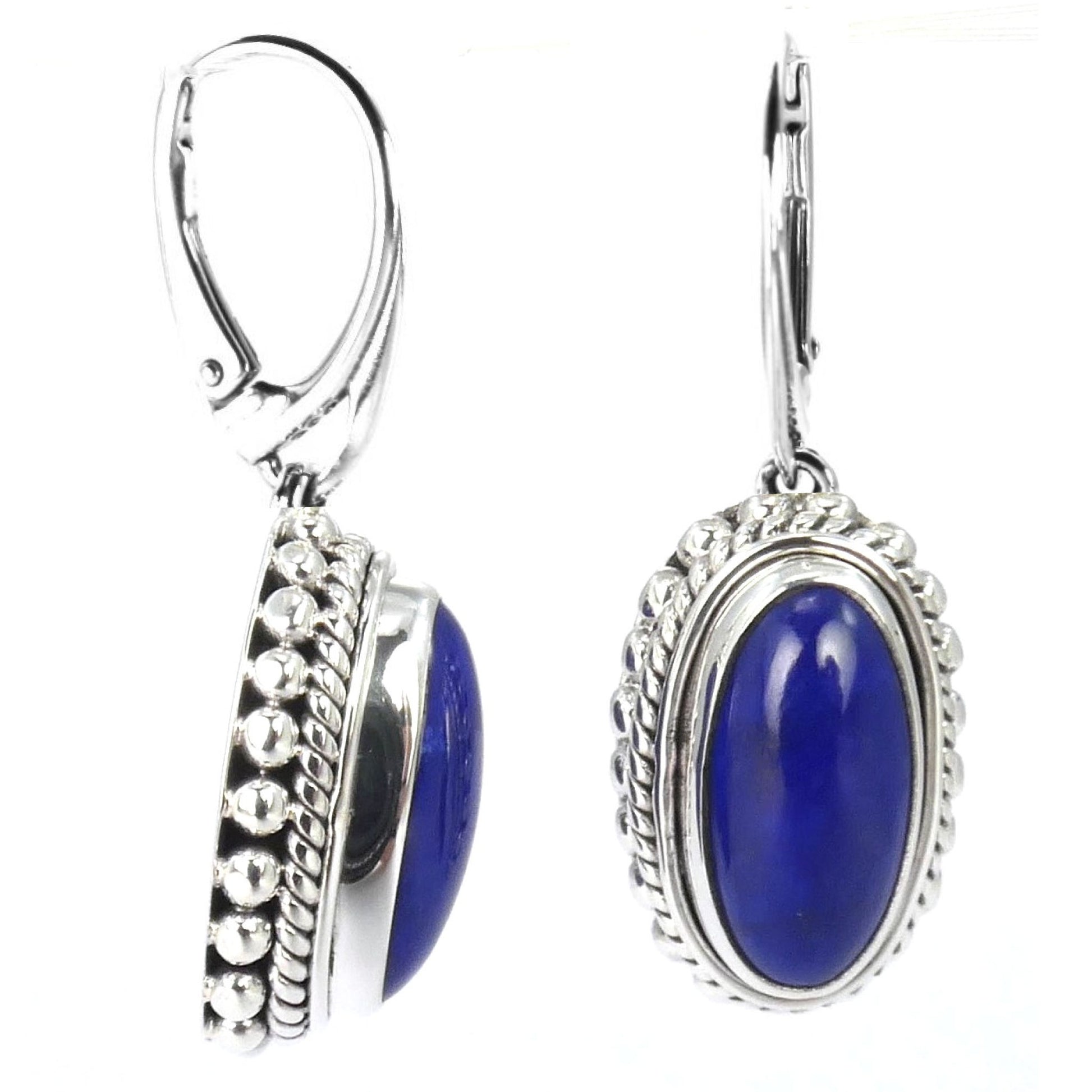 Silver earrings with oval lapis gemstones.