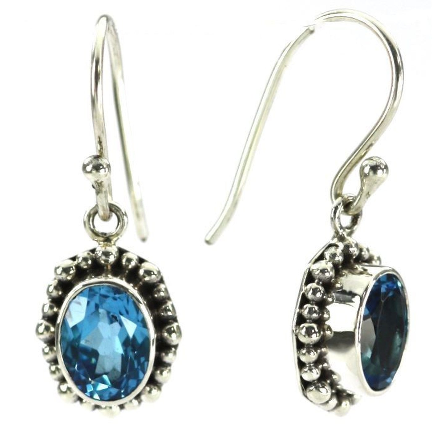 Silver earrings with oval blue topaz gemstones.