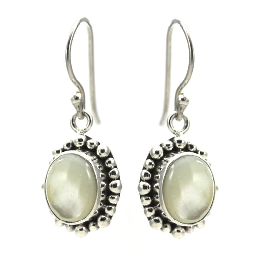 Silver earrings with oval mother of pearl stones and beaded borders.