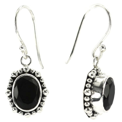 Silver earrings with oval faceted onyx stones and beaded borders.