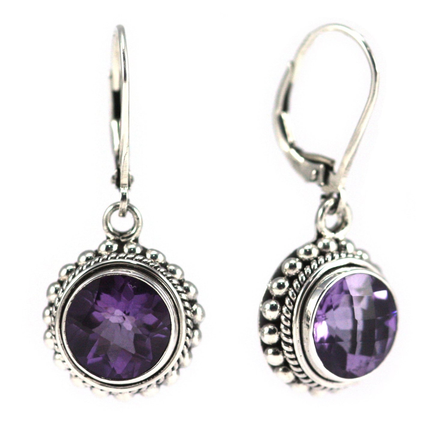 Silver earrings with round purple amethyst gemstones.