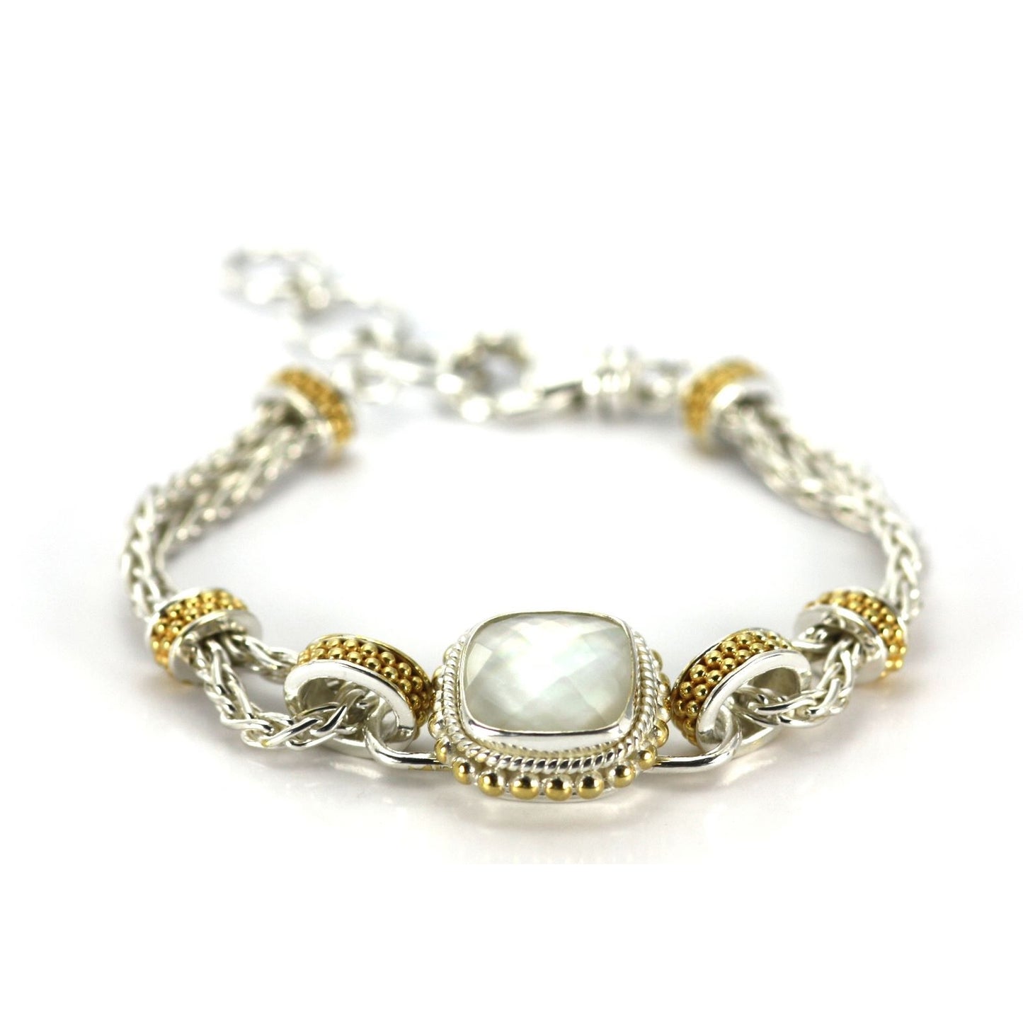 Silver and 18 karat gold vermeil bracelet with one center station with a mother of pearl doublet gemstone.