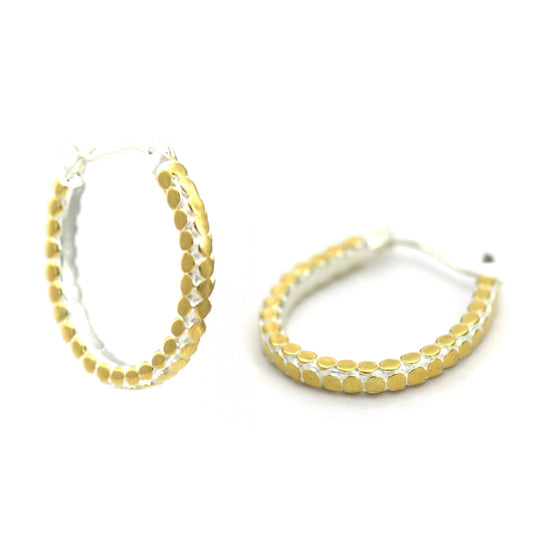 Sterling silver and gold horseshoe earrings.