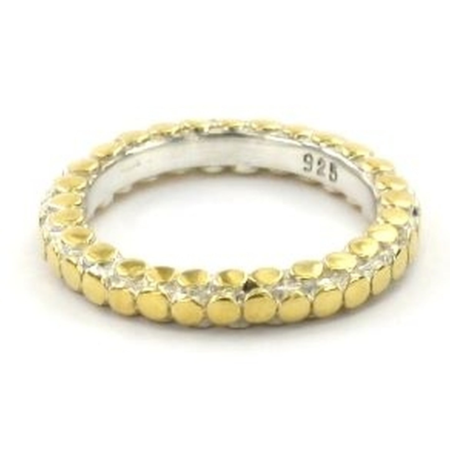Silver and gold ring with flat dot adornment.