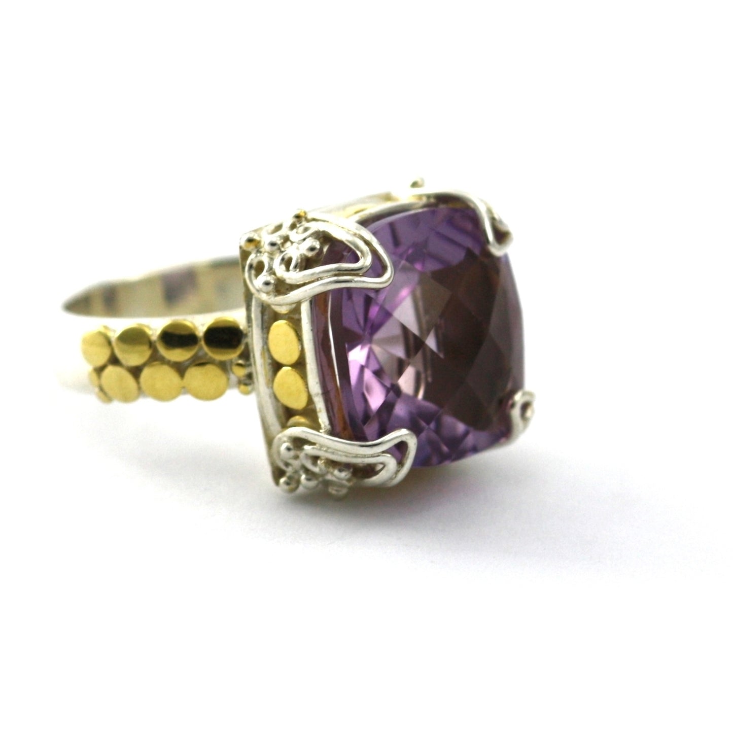 Silver and gold ring with large purple amethyst gemstone.