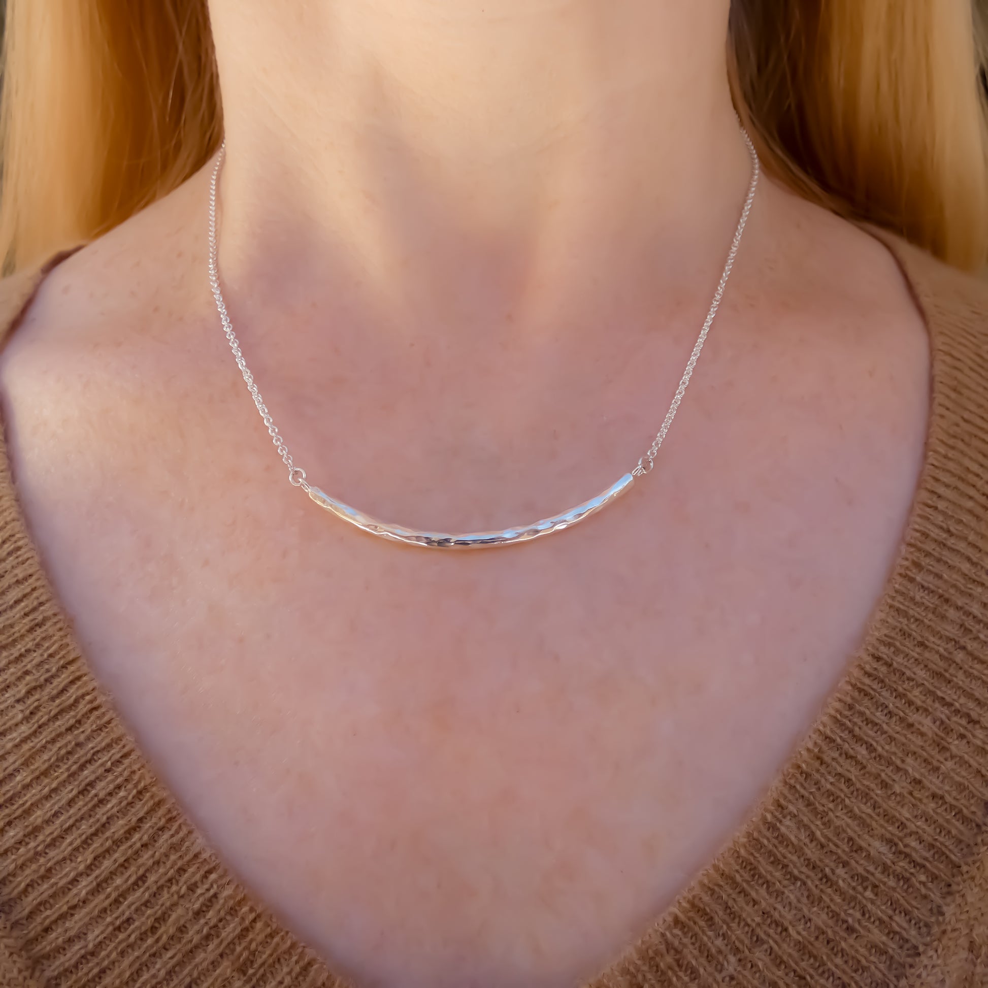 Sterling silver curved bar necklace.