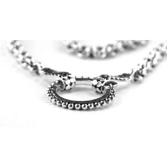 Rolo sterling silver necklace with a hammered center ring.