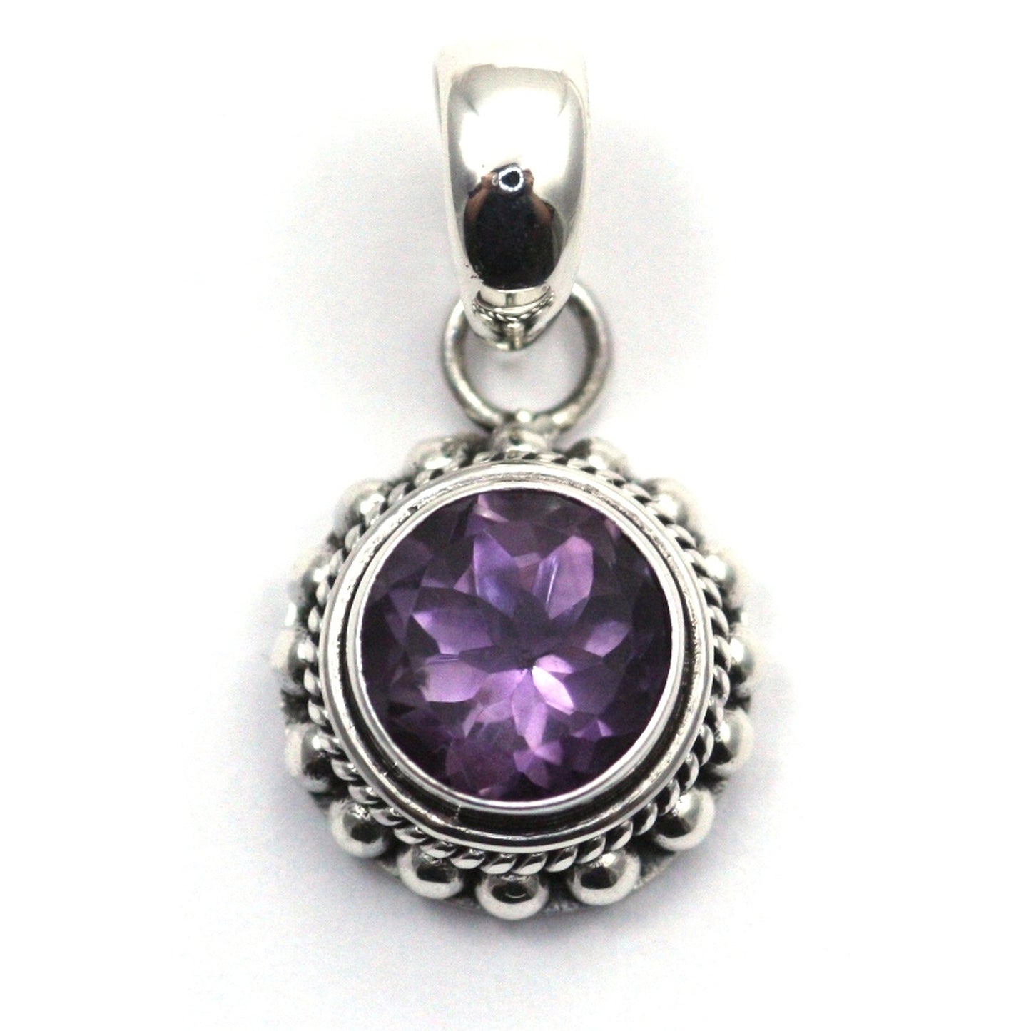 Sterling silver and round amethyst pendant. 
