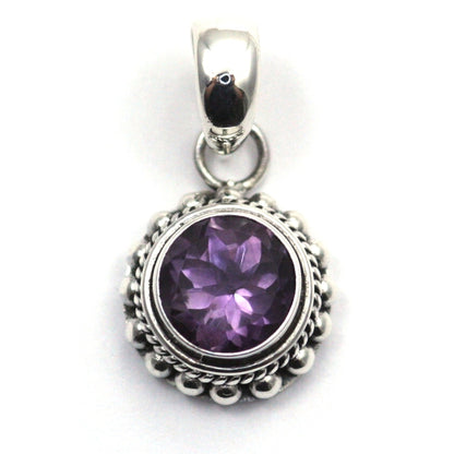 Sterling silver and round amethyst pendant. 