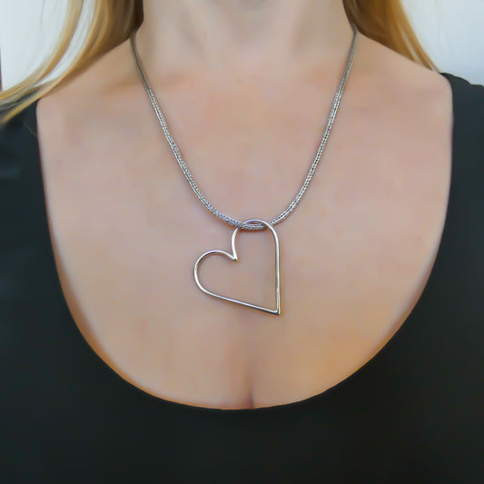 Sterling silver heart charm.